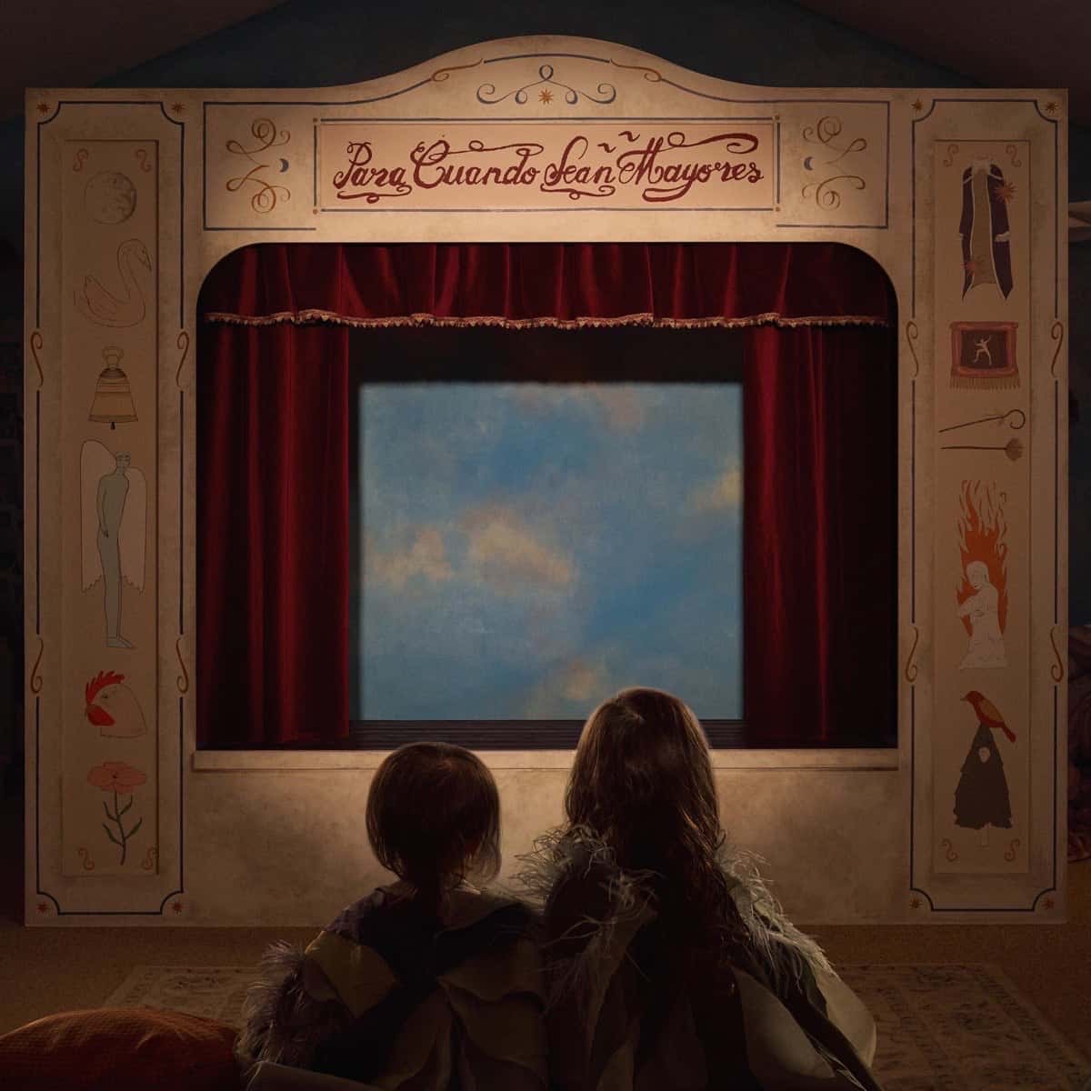Portada de «Para Cuando Sean Mayores», de Camilo: dos nenas de espaldas miran un pequeño teatro de títeres con telón rojo y un cielo pintado en el centro
